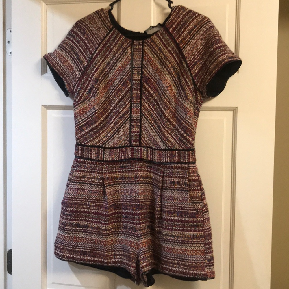 Adelyn Rae colorful romper with leather lining.